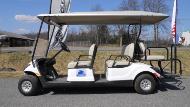 White Six-Seater Golf Cart.