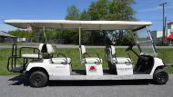 White Eight-Seater Golf Cart.